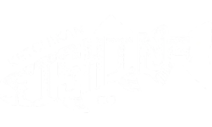 A logo that says Ketchikan Fishing Company thats shaped like a salmon.