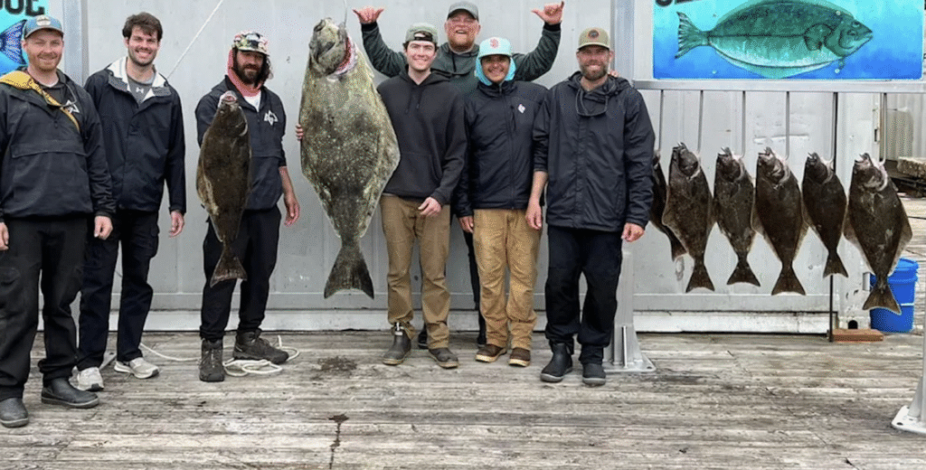 USCG-certified Ketchikan fishing guide helping several guests land halibut